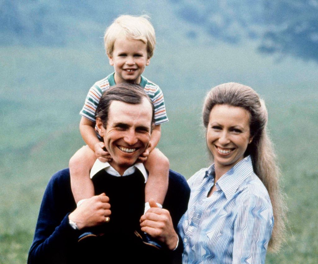 Mark Phillips with his son Peter on his shoulders next to wife Princess Anne