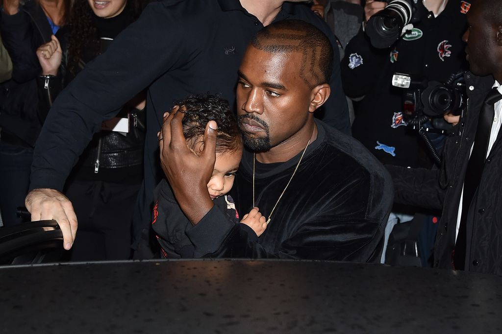 Kanye West and North West arrive at Balenciaga Show during Paris Fashion Week, Womenswear SS 2015 on September 24, 2014