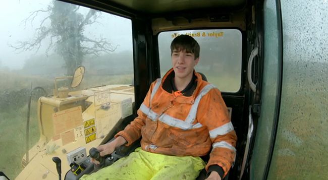 Reuben Owen sits in excavator on Channel 5 show