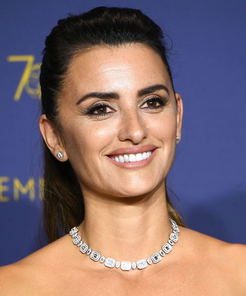 Penelope Cruz smiling with her hair in a ponytail