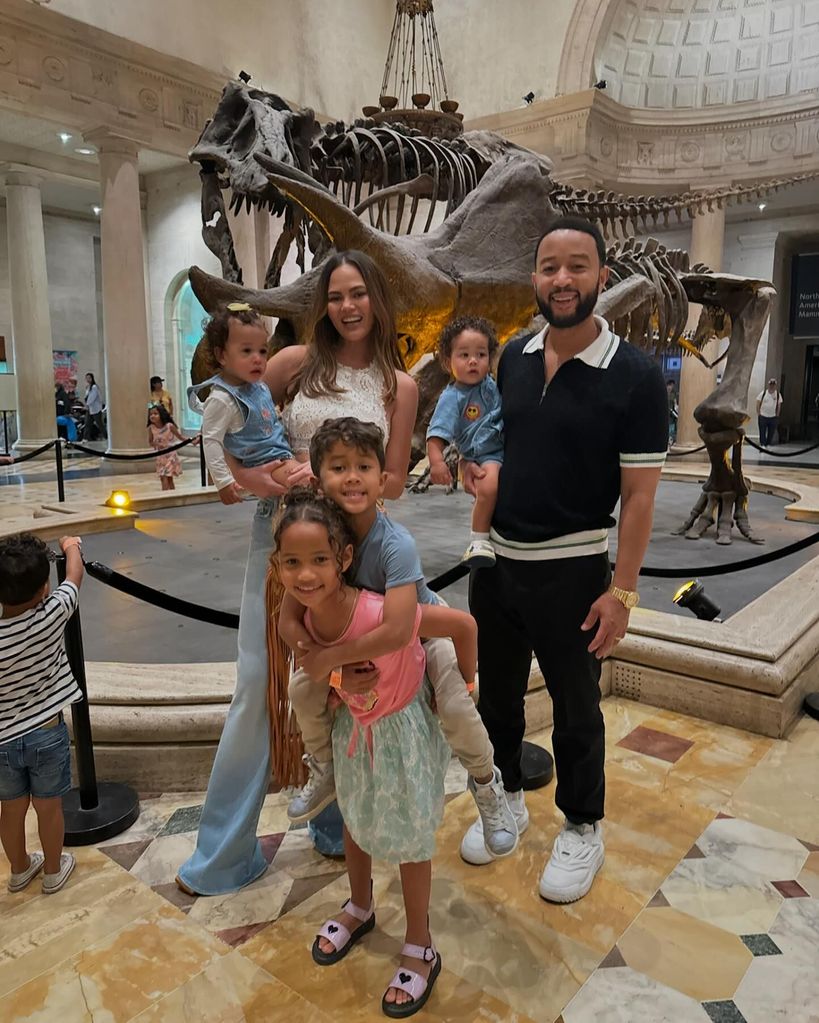 Chrissy Teigen and John Legend with four kids at museum