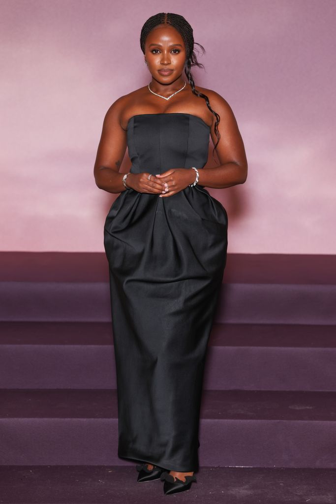 Masali Baduzu in a grey dress