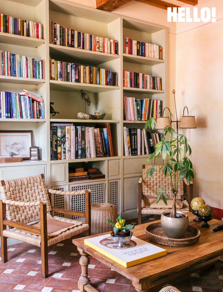 One of the sitting areas with a bookshelf in Villa Talamo