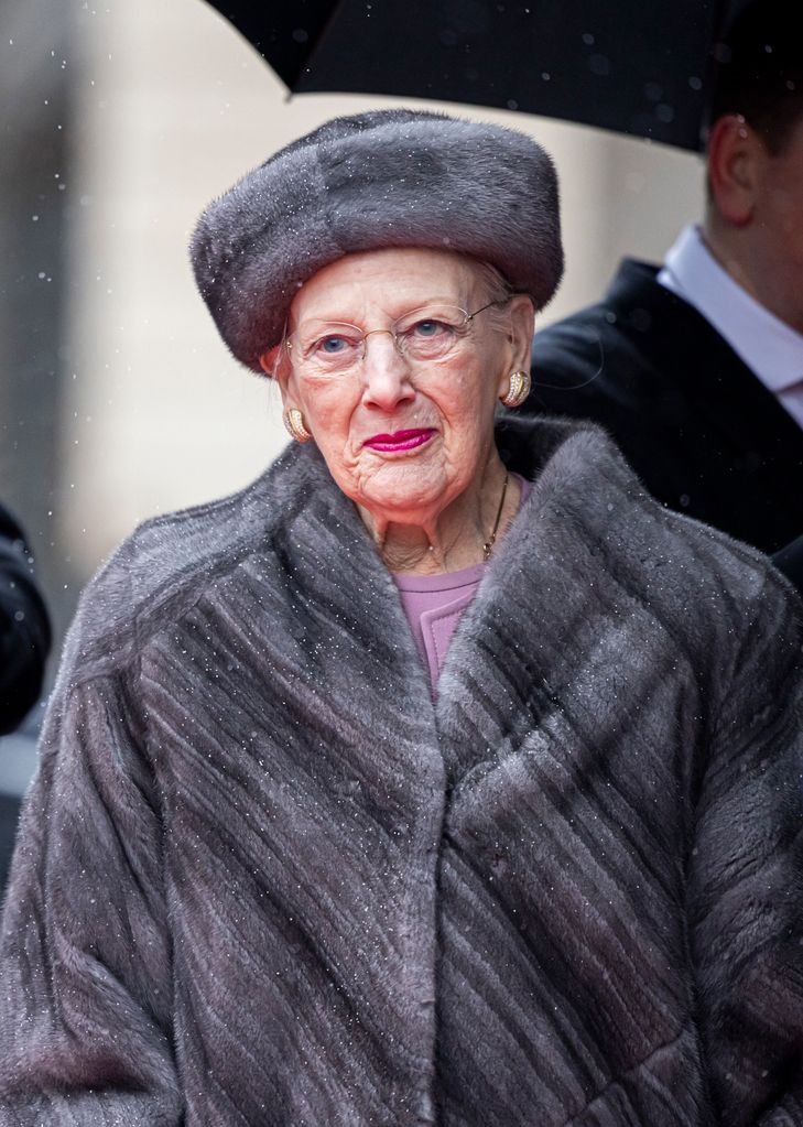 Queen Margrethe of Denmark wrapped up warm in a furry coat and hat