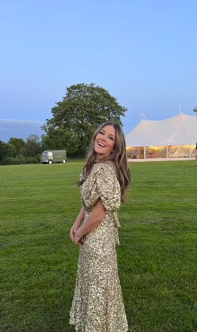 elizabeth hurley in gold dress in field