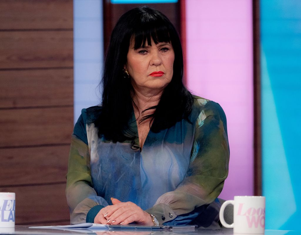 Coleen Nolan in a blue and green top