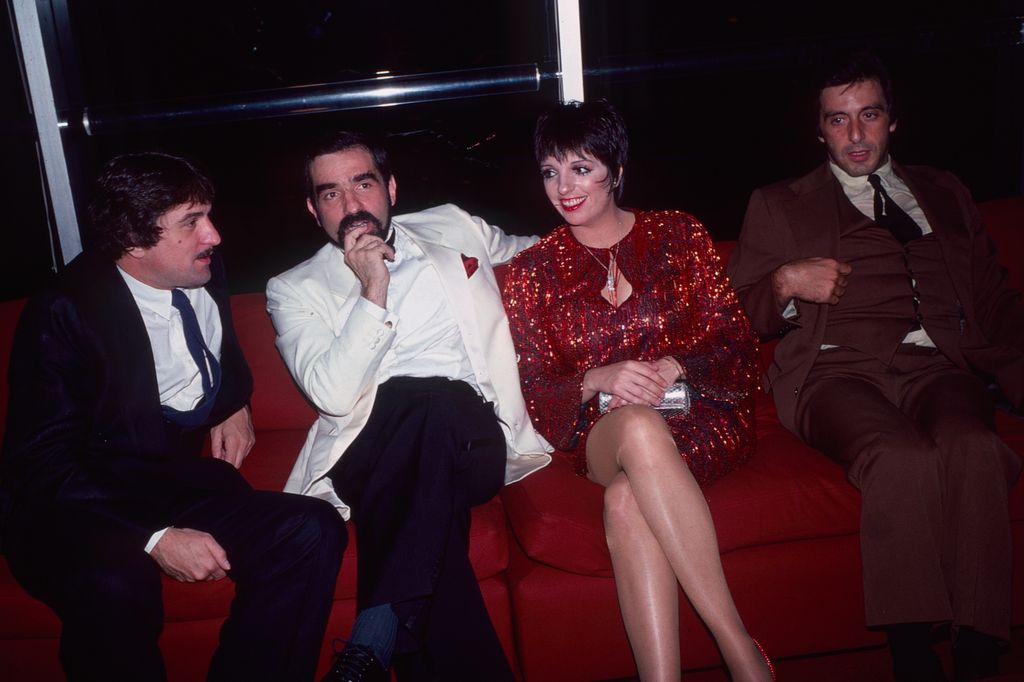 View of, from left, American actor Robert De Niro, film director Martin Scorsese, and actors Liza Minnelli & Al Pacino as they sit together on a sofa at an unspecified event, New York, New York, 1981