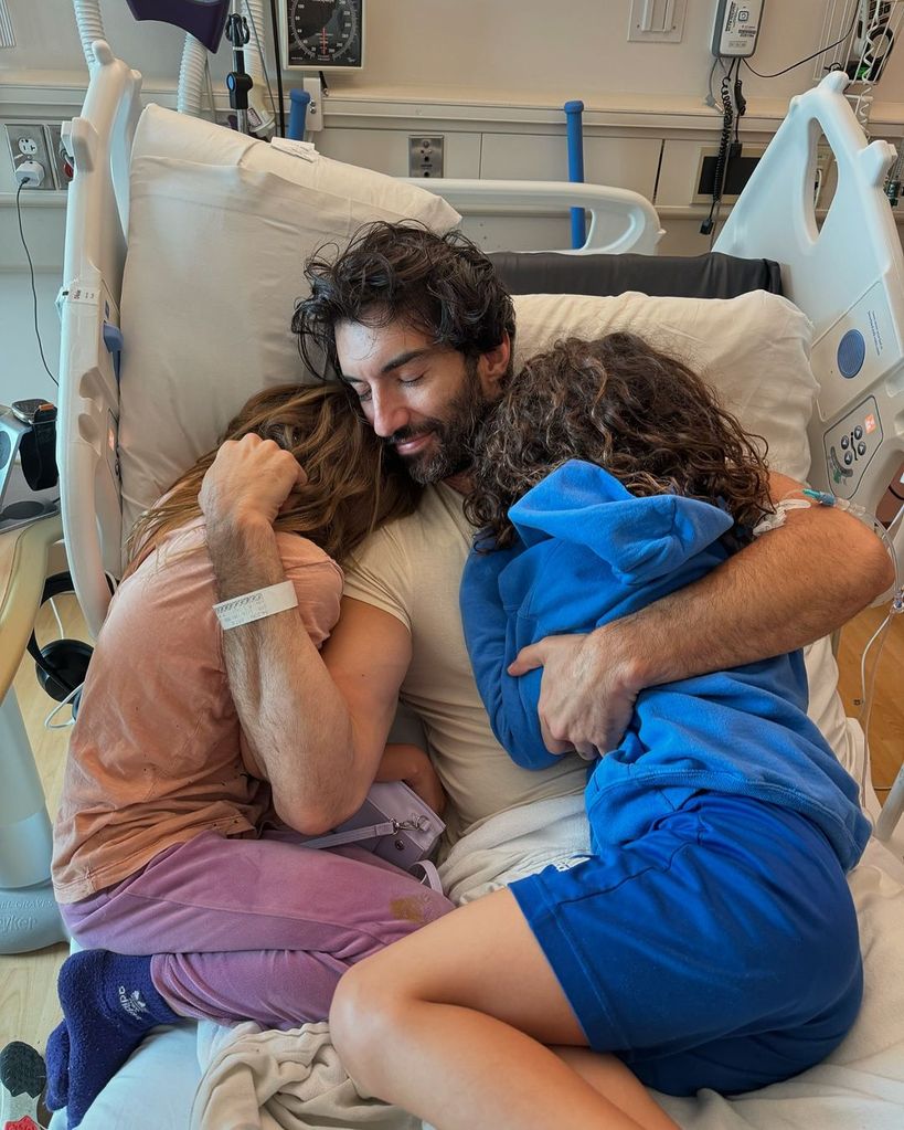 Justin Baldoni is snuggled up in a hospital bed with his two children Maxwell and Maiya, as can be seen on Instagram