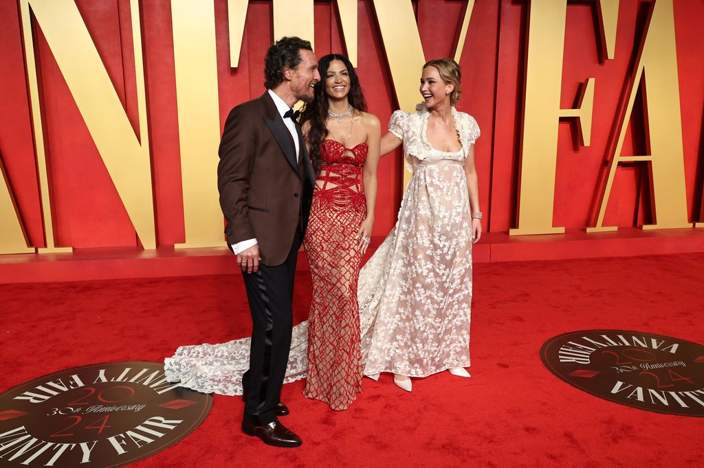 Matthew McConaughey, Camila Alves, and Jennifer Lawrence attend the 2024 Vanity Fair Oscar Party Hosted By Radhika Jones at Wallis Annenberg Center for the Performing Arts on March 10, 2024 in Beverly Hills, California.