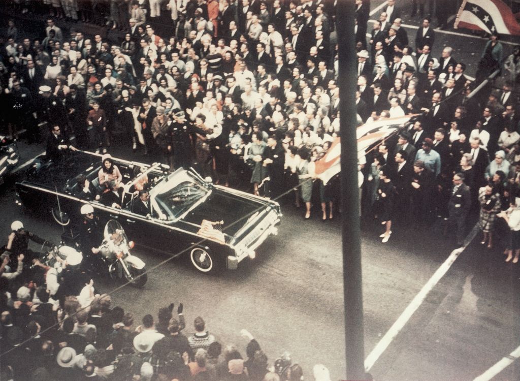 President John F Kennedy, First Lady Jacqueline Kennedy, and Texas Governor John Connally ride through the streets of Dallas, Texas prior to the assassination on November 22, 1963