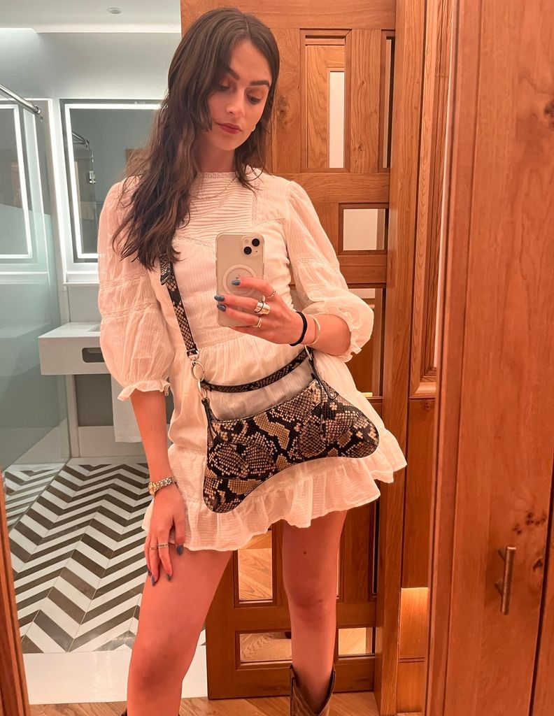 girl in white Reformation mini dress