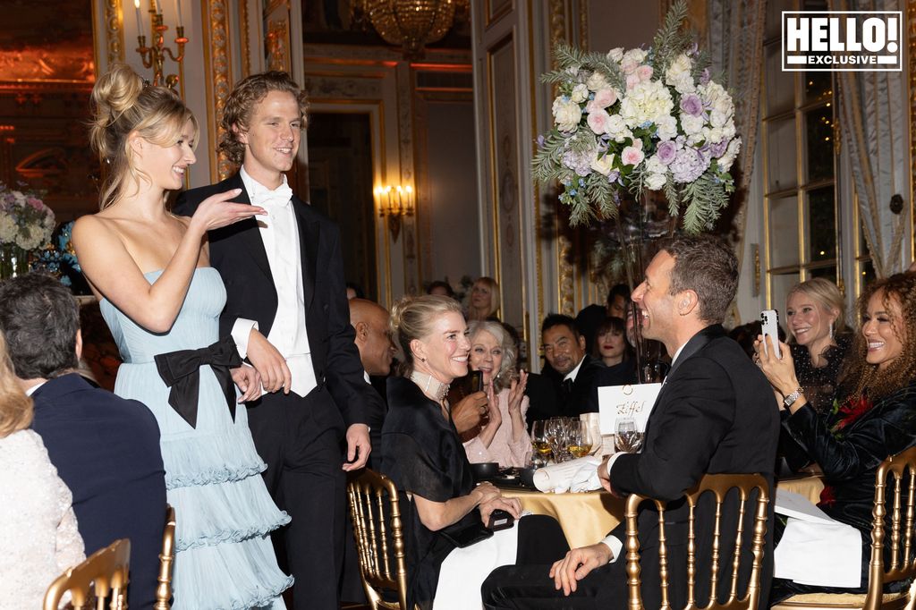 Apple Martin blowing dad Chris a kiss as Gwyneth Paltrow watches