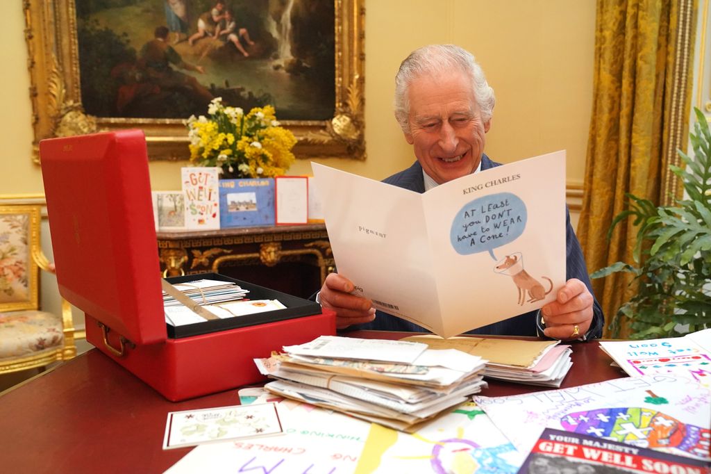 King Charles laughing at get well card