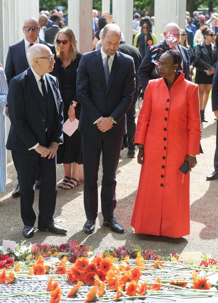  Prince William, Prince of Wales (C) stands with London bombings survivor Thelma Stober (R) during a memorial service for the 20th Anniversary of the 7th of July 2005 bombings 