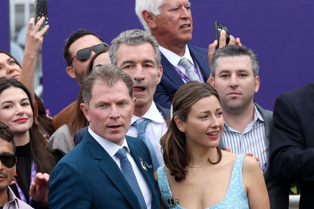 Bobby Flay celebrates in the winners circle with Christina Perez after his horse won the Breeders' Cup Juvenile Fillies Turf at Del Mar Race Track on November 05, 2021 in Del Mar, California