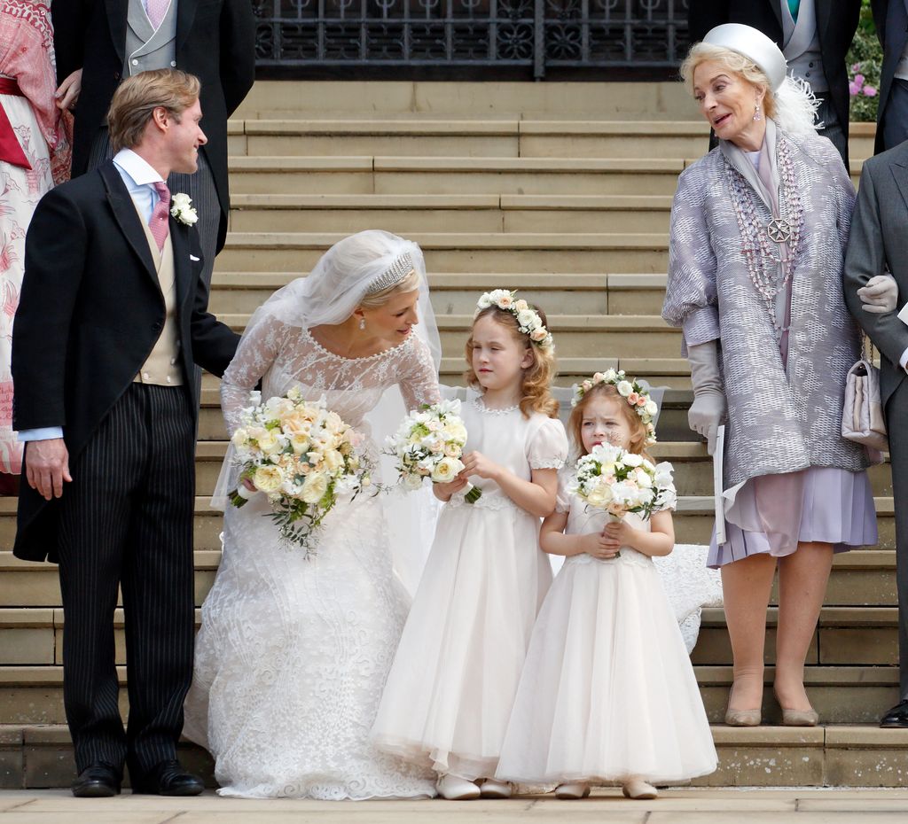 Lady Gabriella Windsor talking to a flower girl following her ceremony