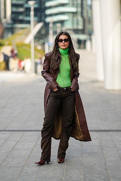 Woman Wearing Dark Denim Jeans With Leather Coat