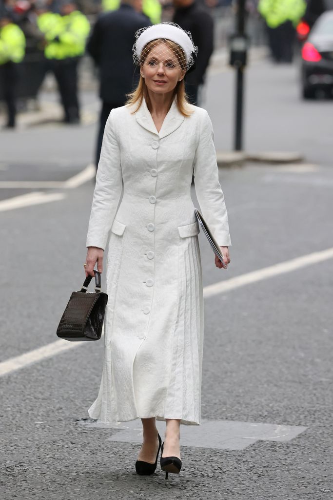 Geri Horner wears a white dress and veiled hat at the Commonwealth Day Service