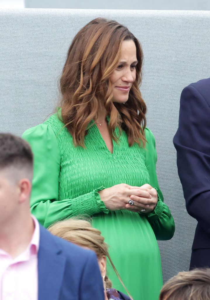 A pregnant Pippa Midleton in a green dress