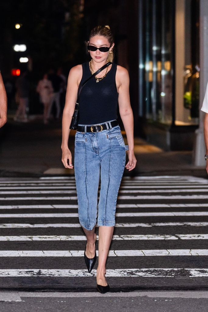 Gigi Hadid was spotted out for dinner in NoHo rocking some knee-length jorts, black mules and a black tank top. She was joined by Queer Eye darling ntoni Porowski