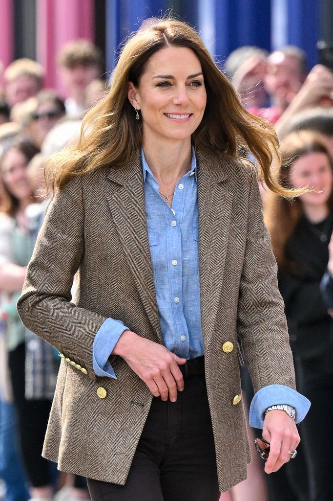 Kate Middleton smiling and walking