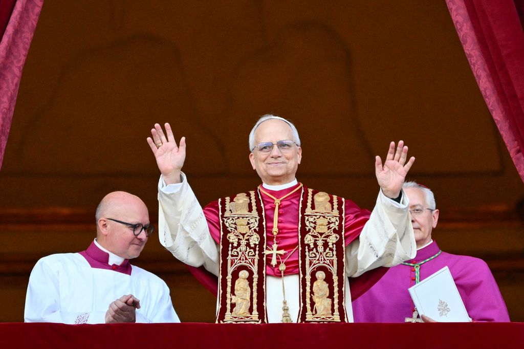 Newly elected Pope Leo XIV, Robert Francis Prevost arrives on the main central loggia balcony of the St Peter's Basilica for the first time