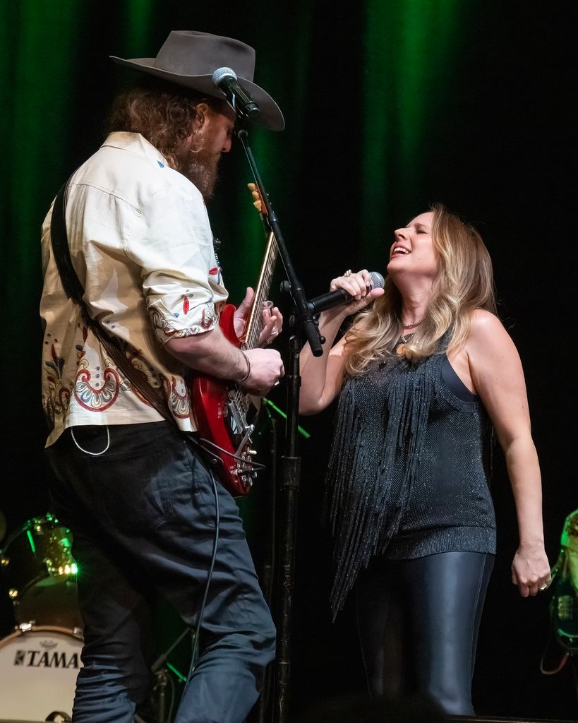 Lucie Silvas (R) performs with husband John Osborne (L) during The Midnight Rider: Gregg Allman's 75th Birthday Jam on December 08, 2022 in New York City.