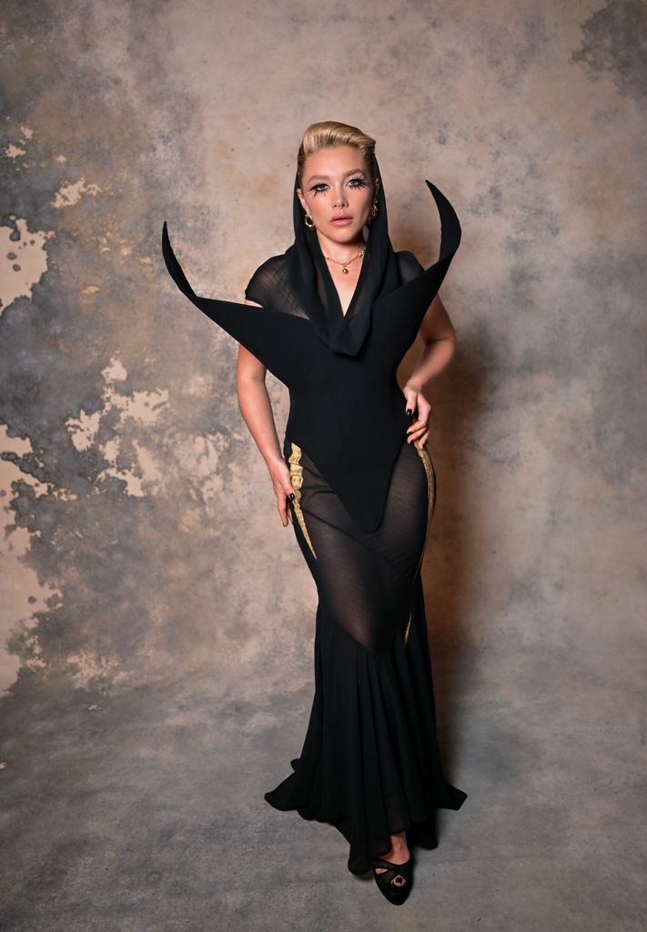 Florence Pugh in black hooded dress