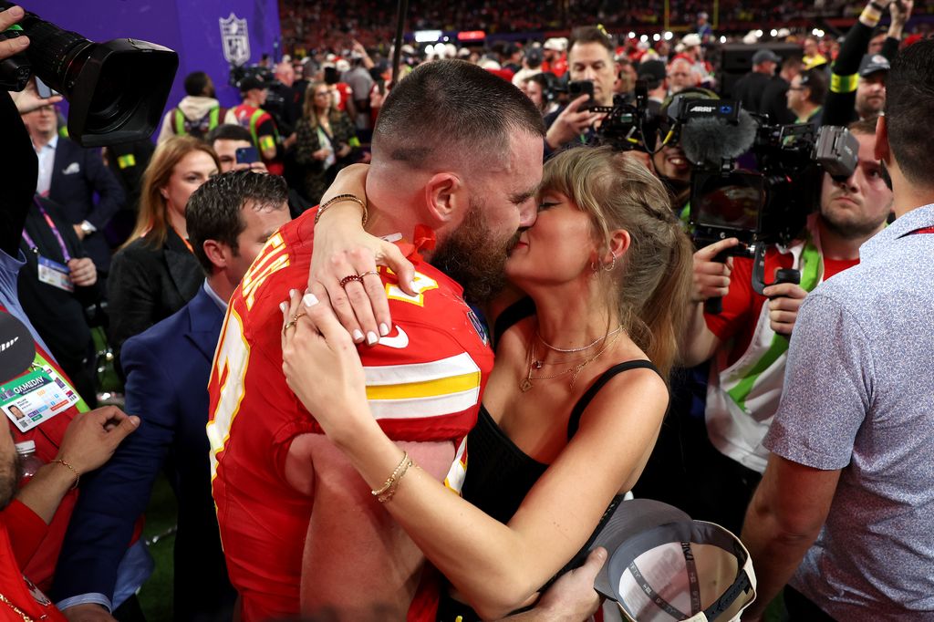 Travis Kelce and Taylor Swift embraced during the Super Bowl in 2024 