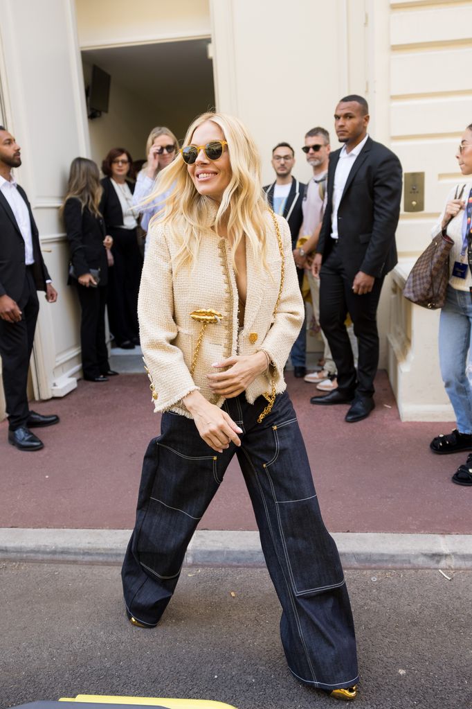 Sienna Miller is seen during the 77th Cannes Film Festival in a tweed blazer and jeans