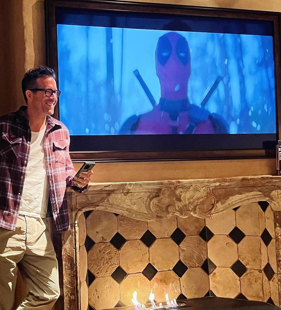 Ryan Reynolds pictured at home watching the trailer for "Deadpool & Wolverine"