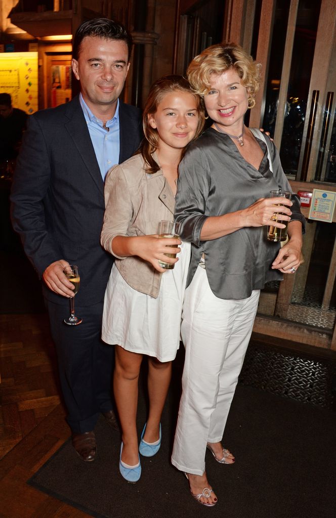 Edward Hall standing with daughter Georgia and wife Issy van Randwyck