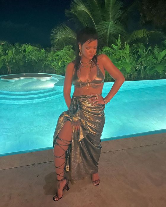 Rihanna posing by the pool