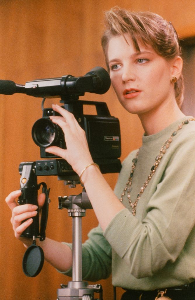 Bridget Fonda video tapes in a scene from the movie "You Can't Hurry Love"