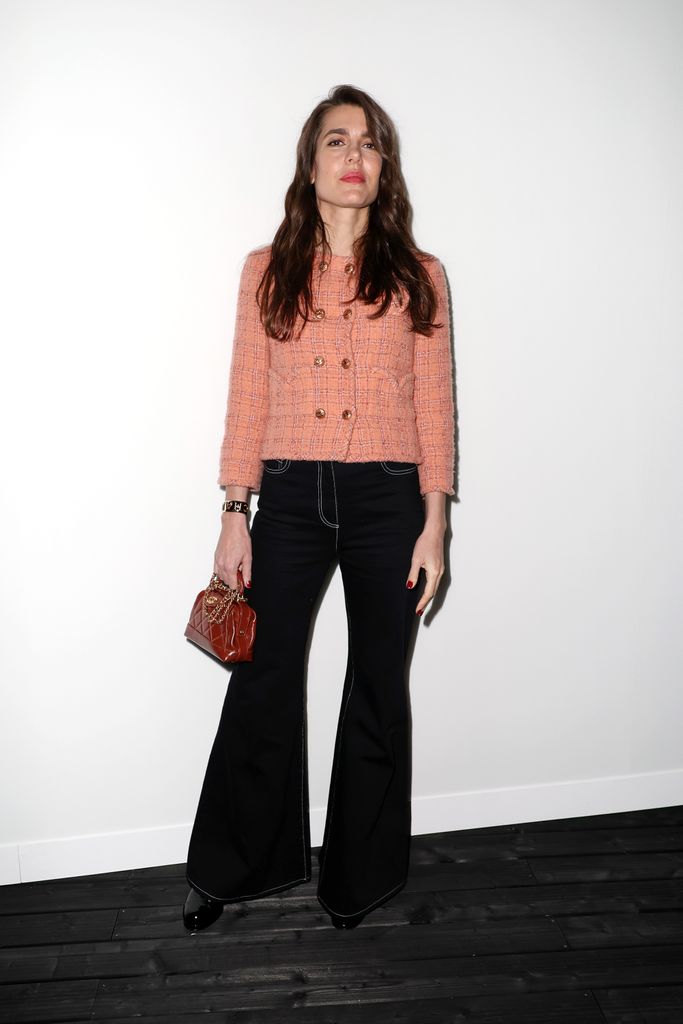 Charlotte Casiraghi in a peach jacket and flares at the Chanel AW24 show