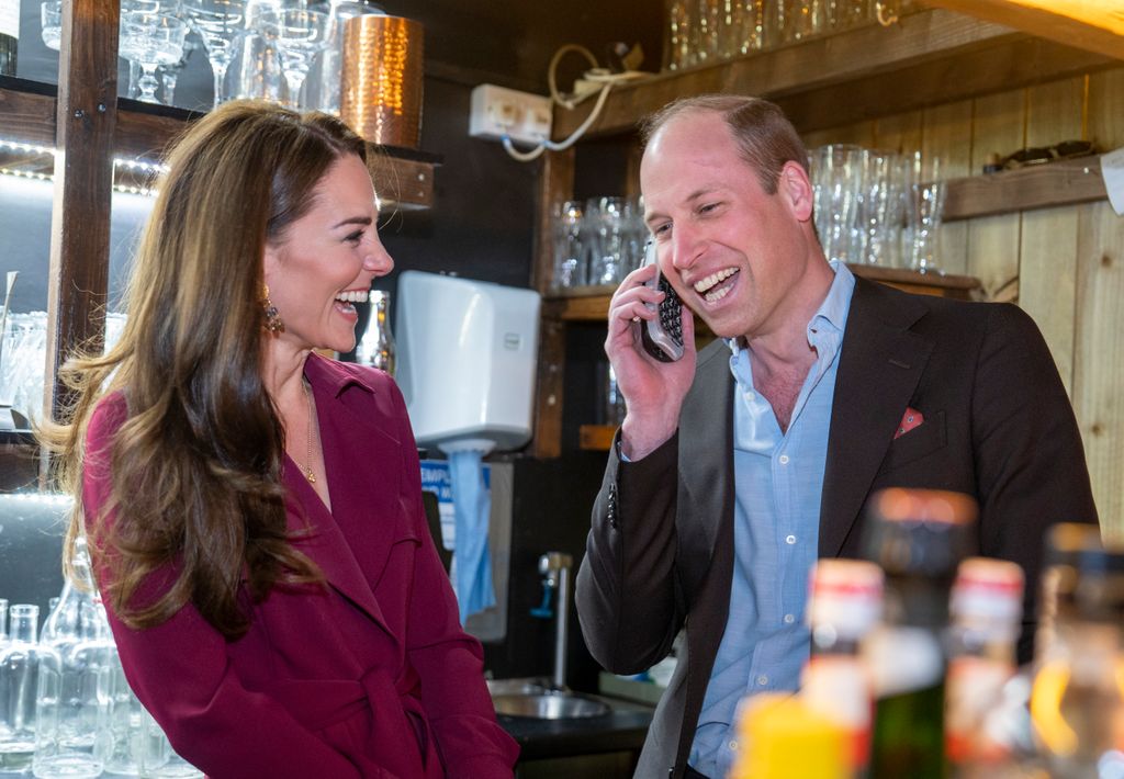 Kate laughs as William takes a restaurant booking at Birmingham restaurant