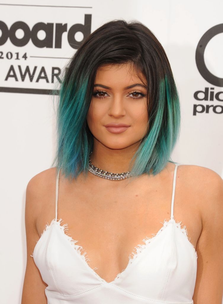 Kylie Jenner in a white top with teal hair in 2014