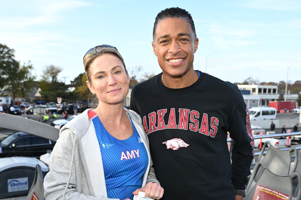 Amy Robach and TJ Holmes run during the 2022 TCS New York City Marathon on November 06, 2022 in New York City