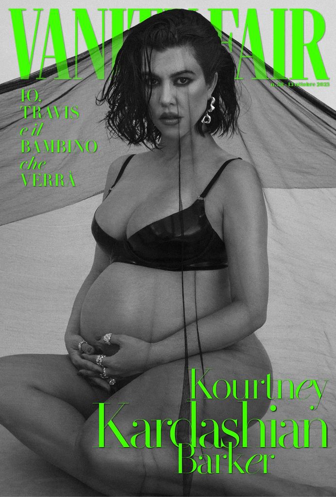 Kourtney Kardashian poses in a lace black bra and cradles her baby bump on the cover of Vanity Fair Italia
