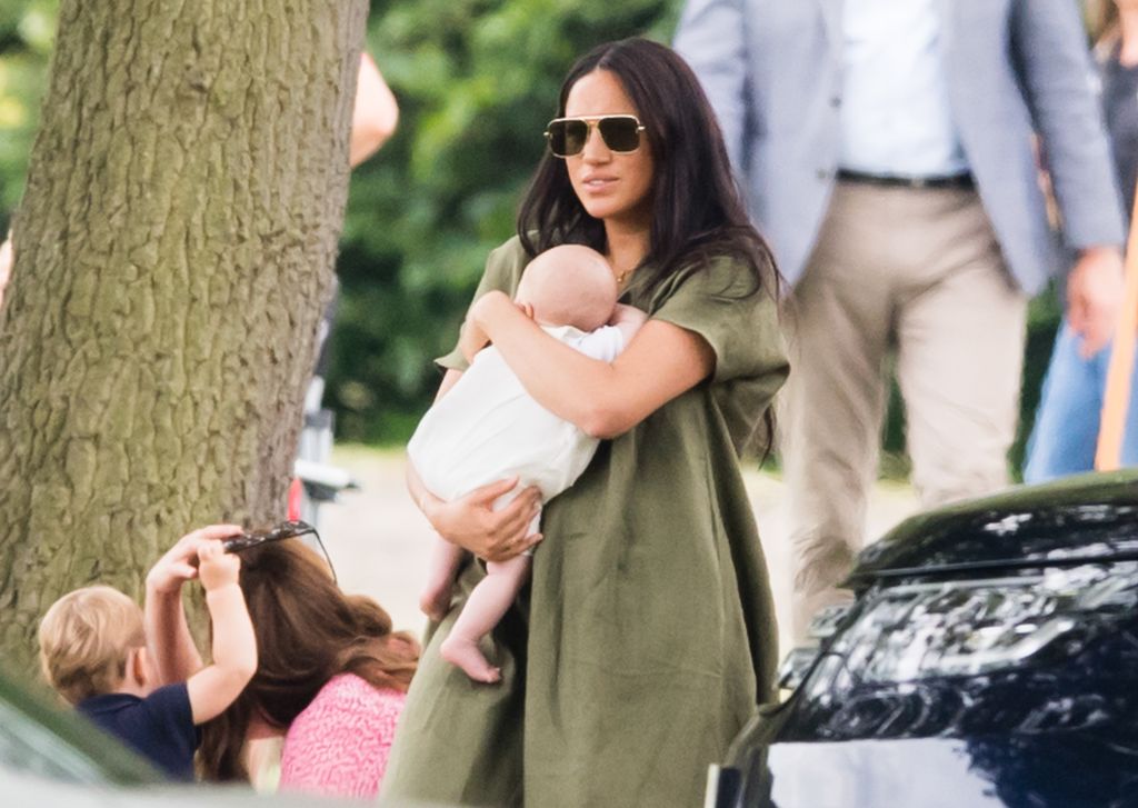 Meghan holds baby Archie at the polo, 2019