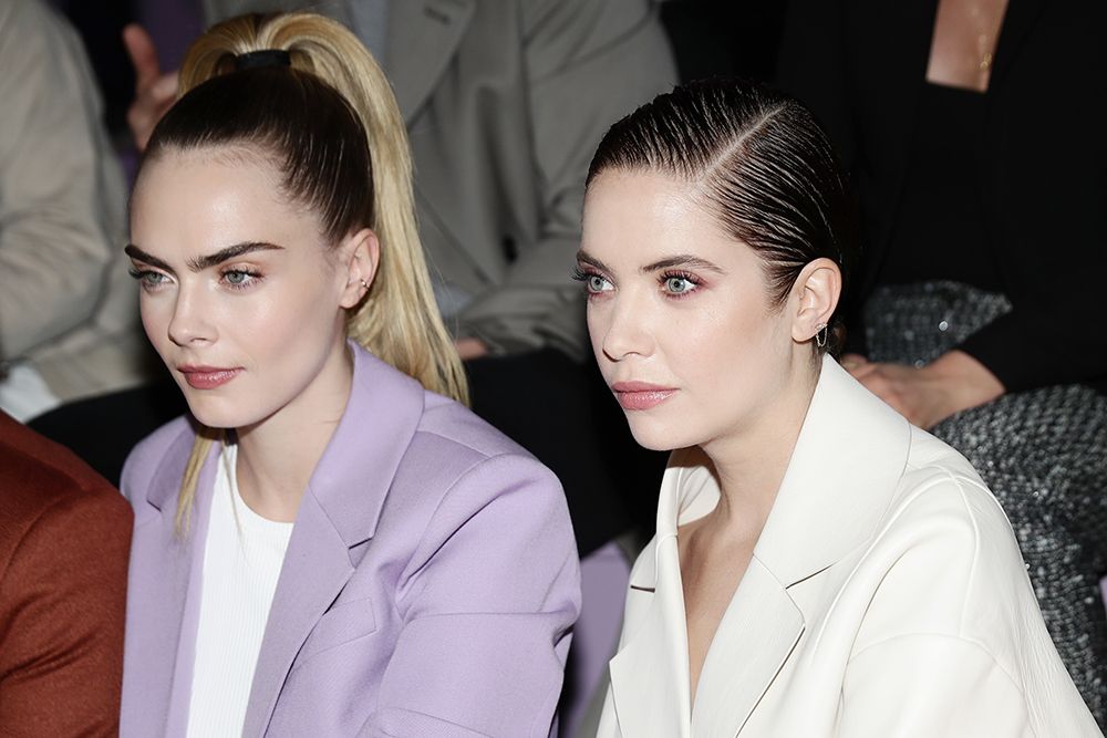 Cara Delevingne and Ashley Benson attend the BOSS fashion show during the Milan Fashion Week Fall