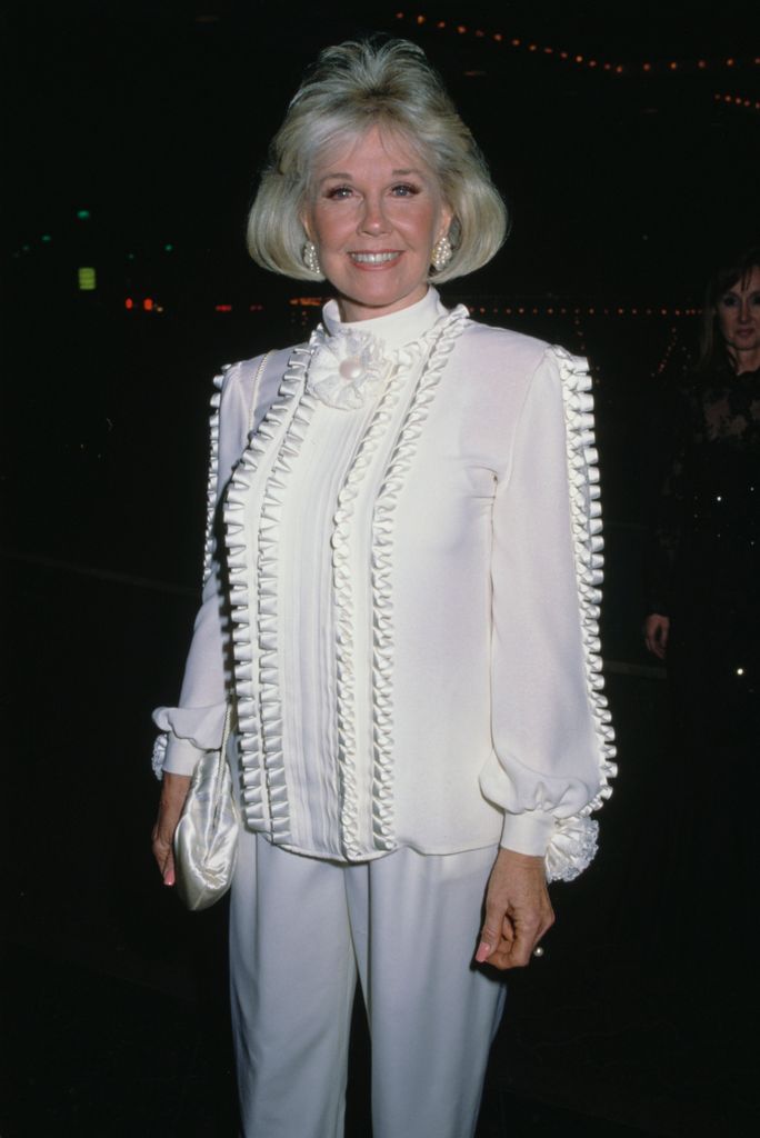 American actress and singer Doris Day (1922-2019), wearing a white blouse with ruffle detail, attends the 46th Annual Golden Globe Awards