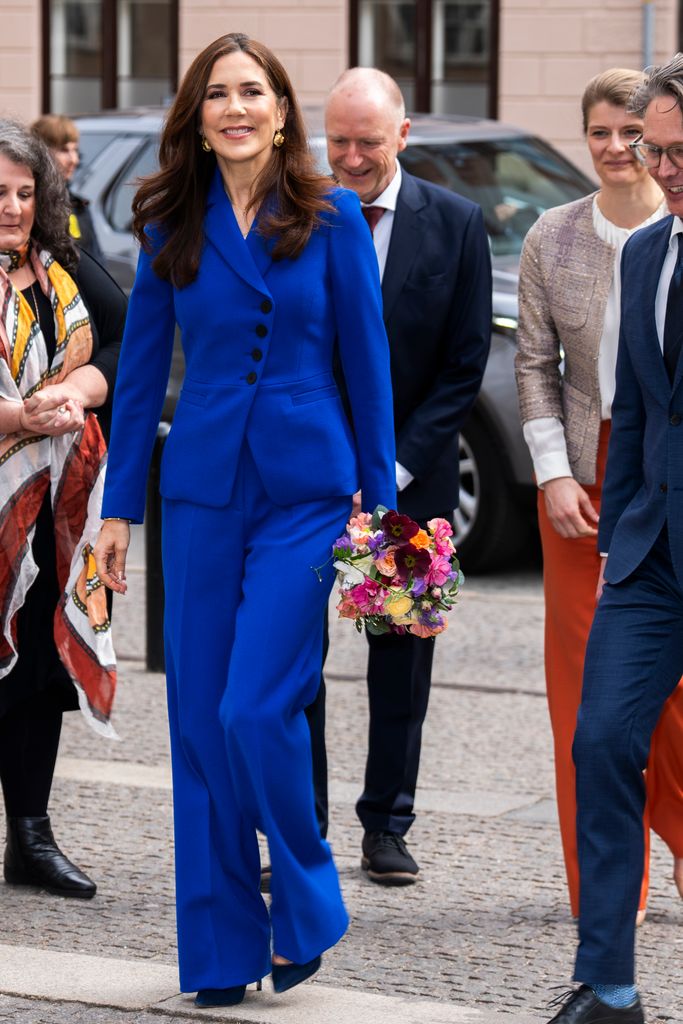 Queen Mary  in a blue suit