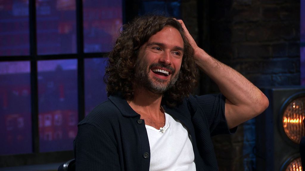 Joe Wicks scratching his head while laughing