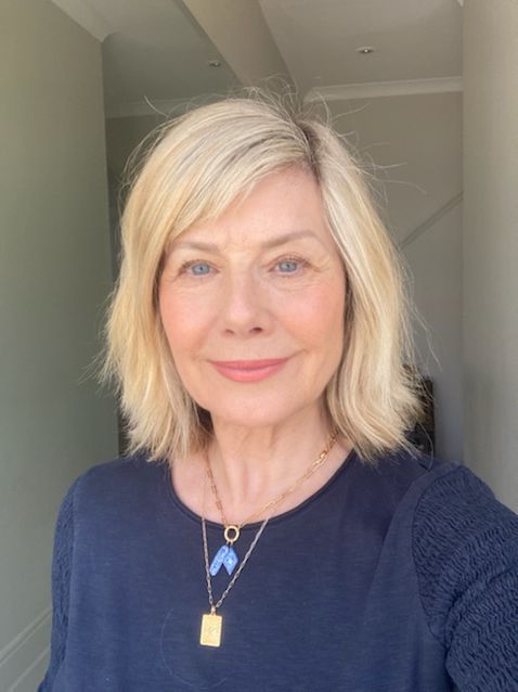woman taking a selfie in a navy jumper 