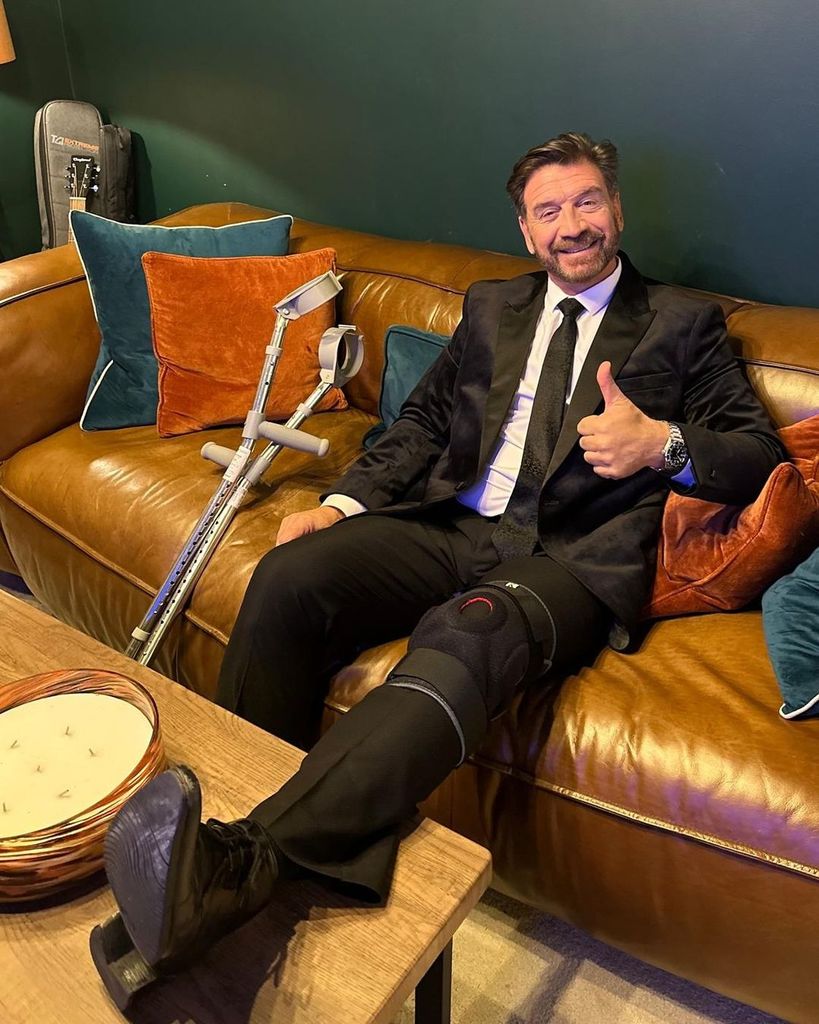 Nick Knowles with his knee in a brace 