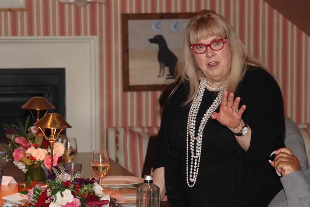 colleen camp talking at dinner table