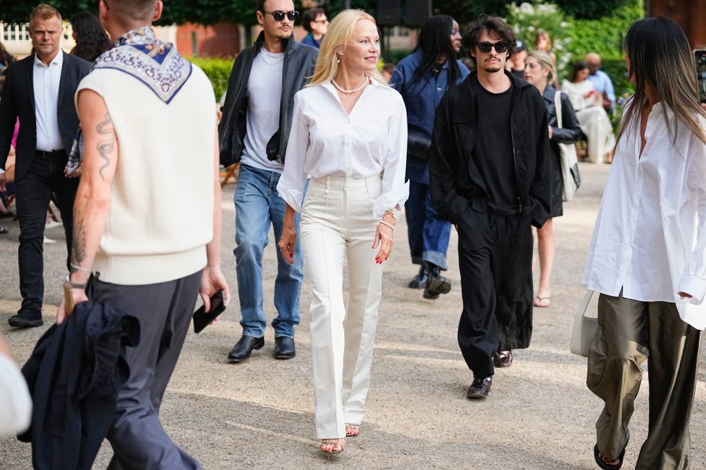  Dylan Lee Jagger, Pamela Anderson and Brandon Thomas Lee attend the ROTATE show during Copenhagen Fashion Week on August 08, 2024 in Copenhagen, Denmark.