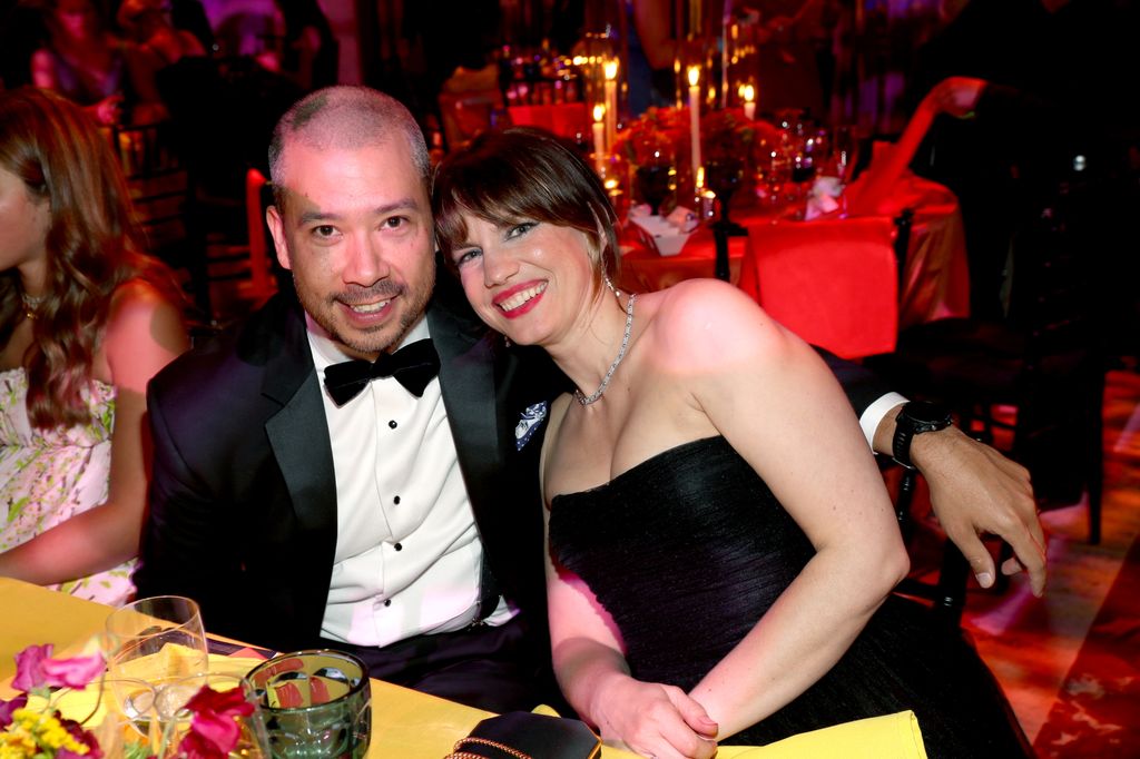 Anna Chlumsky with her husband Shaun So at a black tie event sitting at a dining table