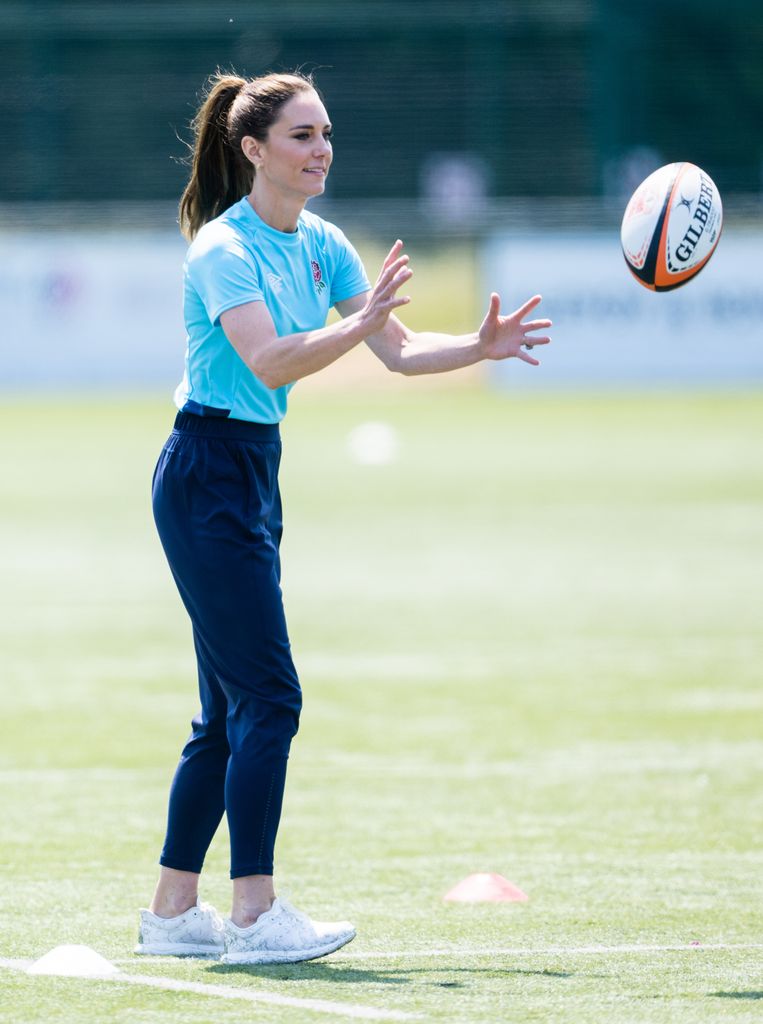 Kate Middleton catches rugby ball at Maidenhead Rugby Club